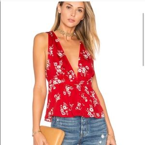 L’Academie red silk Peplum top. Size small. NWOT